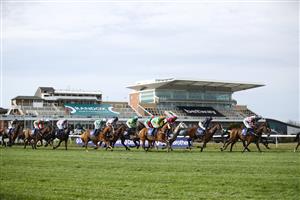 LIVERPOOL, ENGLAND - APRIL 08: Runners and riders pass in front of the empty grandstands in the Close Brothers Red Rum Handicap Chase during the Liverpool NHS Day of the 2021 Randox Health Grand National Festival at Aintree Racecourse on April 8, 2021 in Liverpool, England. (Photo by Tim Goode - Pool/Getty Images)
