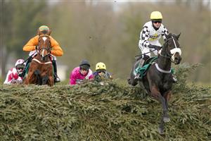 LIVERPOOL, ENGLAND - APRIL 08: James King riding Cousin Pascal (R) clear 'The Chair' on their way to winning The Rose Paterson Randox Foxhunters' Open Hunters' Chase at Aintree Racecourse on April 08, 2021 in Liverpool, England. Sporting venues around the UK remain under restrictions due to the Coronavirus Pandemic. Only owners are allowed to attend the meeting but the public must wait until further restrictions are lifted. (Photo by Alan Crowhurst/Getty Images)