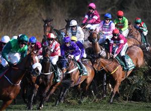 LIVERPOOL, ENGLAND - APRIL 14: Runners and riders jump Canal Turn on the first time of asking during the 2018 Randox Health Grand National at Aintree Racecourse on April 14, 2018 in Liverpool, England. (Photo by Laurence Griffiths/Getty Images)