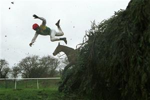 7 Apr 2001: Tom Doyle of Ireland parts company with his mount Esprit de Cotte at the 11th fence during The Martell Grand National at Aintree, Leverpool. Mandatory Credit: Mike Hewitt/ALLSPORT