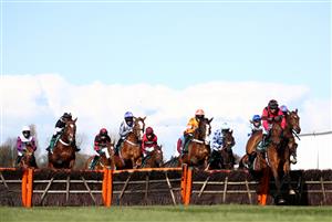 LIVERPOOL, ENGLAND - APRIL 09: Derek Fox riding Ahoy Senor (right) leads on the first lap of the Doom Bar Sefton Novices' Hurdle during Ladies Day of the 2021 Randox Health Grand National Festival at Aintree Racecourse on April 9, 2021 in Liverpool, England. (Photo by Tim Goode - Pool / Getty Images)