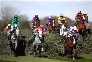 LIVERPOOL, ENGLAND - APRIL 09: Runners and riders jump the Chair on the first lap of the Randox Topham Handicap Chase during Ladies Day of the 2021 Randox Health Grand National Festival at Aintree Racecourse on April 9, 2021 in Liverpool, England. (Photo by Tim Goode - Pool / Getty Images)