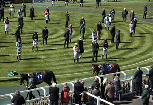 LIVERPOOL, ENGLAND - APRIL 09: Racegoers and riders observe a two-minute silence for the late Prince Philip, Duke of Edinburgh, before the Pertemps Network Handicap Hurdle during Ladies Day of the 2021 Randox Health Grand National Festival at Aintree Racecourse on April 9, 2021 in Liverpool, England. (Photo by Tim Goode - Pool / Getty Images)