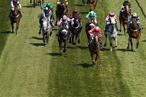 LIVERPOOL, ENGLAND - APRIL 09: Jack Kennedy riding Tronador (C, red/white) clear the last to win The Pertemps Network Handicap Hurdle at Aintree Racecourse on April 09, 2021 in Liverpool, England. Sporting venues around the UK remain under restrictions due to the Coronavirus Pandemic. Only owners are allowed to attend the meeting but the public must wait until further restrictions are lifted. (Photo by Alan Crowhurst/Getty Images)