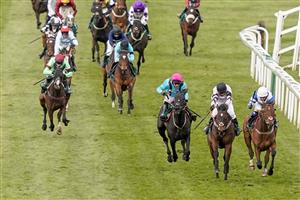 LIVERPOOL, ENGLAND - APRIL 10: Megan Nicholls riding Knappers Hill (blue) win The Weatherbys nhstallions.co.uk Standard Open NH Flat Race at Aintree Racecourse on April 10, 2021 in Liverpool, England. Sporting venues around the UK remain under restrictions due to the Coronavirus Pandemic. Only owners are allowed to attend the meeting but the public must wait until further restrictions are lifted. (Photo by Alan Crowhurst/Getty Images)