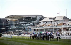 LIVERPOOL, ENGLAND - APRIL 10: Runners and riders pass the grandstand, with the Union Jack flag at half mast, on the first lap in the the EFT Systems Handicap Hurdle during Grand National Day of the 2021 Randox Health Grand National Festival at Aintree Racecourse on April 10, 2021 in Liverpool, England. (Photo by Tim Goode - Pool / Getty Images)