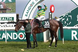 LIVERPOOL, ENGLAND - APRIL 10: Rachael Blackmore celebrates winning on Minella Times, the Randox Grand National Handicap Chase, on Grand National Day of the 2021 Randox Health Grand National Festival at Aintree Racecourse on April 10, 2021 in Liverpool, England. (Photo by Tim Goode - Pool/Getty Images)