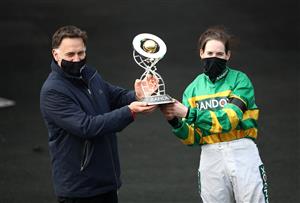 LIVERPOOL, ENGLAND - APRIL 10: Rachael Blackmore and Trainer Henry De Bromhead celebrate with the trophy after winning the Randox Grand National Handicap Chase on Minella Times during Grand National Day of the 2021 Randox Health Grand National Festival at Aintree Racecourse on April 10, 2021 in Liverpool, England. (Photo by Tim Goode - Pool/Getty Images)