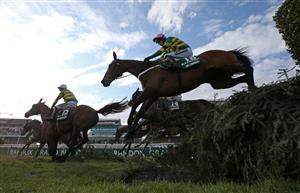 LIVERPOOL, ENGLAND - APRIL 10: Runners and riders clear the water jump during the Randox Grand National Handicap Chase, on Grand National Day of the 2021 Randox Health Grand National Festival at Aintree Racecourse on April 10, 2021 in Liverpool, England. (Photo by Tim Goode - Pool/Getty Images)