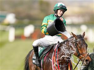 LIVERPOOL, ENGLAND - APRIL 10: Rachael Blackmore cools down Minella Times after winning The Randox Grand National Handicap Chase at Aintree Racecourse on April 10, 2021 in Liverpool, England. Sporting venues around the UK remain under restrictions due to the Coronavirus Pandemic. Only owners are allowed to attend the meeting but the public must wait until further restrictions are lifted. (Photo by Alan Crowhurst/Getty Images)