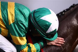 LIVERPOOL, ENGLAND - APRIL 10: Rachael Blackmore celebrates winning on Minella Times, the Randox Grand National Handicap Chase, on Grand National Day of the 2021 Randox Health Grand National Festival at Aintree Racecourse on April 10, 2021 in Liverpool, England. (Photo by Tim Goode - Pool/Getty Images)