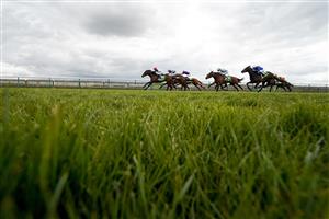 NEWMARKET, ENGLAND - APRIL 15: Nicky Mackay riding Peter The Great (L, red cap) win The bet365 Wood Ditton Maiden Stakes at Newmarket Racecourse on April 15, 2021 in Newmarket, England. Sporting venues around the UK remain under restrictions due to the Coronavirus Pandemic. Only owners are allowed to attend the meeting but the public must wait until further restrictions are lifted. (Photo by Alan Crowhurst/Getty Images)