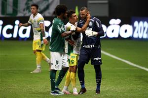 BRASILIA, BRAZIL - APRIL 14: Weverton of Palmeiras is comforted by teammate Luiz Adriano and Miguel Merentiel of Defensa y Justicia after missing his penalty in the shootout after a match between Palmeiras and Defensa y Justicia as part of the second leg of the Conmebol Recopa at Mane Garrincha Stadium on April 14, 2021 in Brasilia, Brazil. (Photo by Buda Mendes/Getty Images)