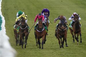 NEWMARKET, ENGLAND - APRIL 15: Daniel Tudhope riding Summerghand (R, brown cap) win The bet365 Abernant Stakes from Ryan Moore riding Oxted (pink) at Newmarket Racecourse on April 15, 2021 in Newmarket, England. Sporting venues around the UK remain under restrictions due to the Coronavirus Pandemic. Only owners are allowed to attend the meeting but the public must wait until further restrictions are lifted. (Photo by Alan Crowhurst/Getty Images)