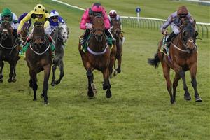 NEWMARKET, ENGLAND - APRIL 15: Daniel Tudhope riding Summerghand (R, brown cap) win The bet365 Abernant Stakes from Ryan Moore riding Oxted (pink) at Newmarket Racecourse on April 15, 2021 in Newmarket, England. Sporting venues around the UK remain under restrictions due to the Coronavirus Pandemic. Only owners are allowed to attend the meeting but the public must wait until further restrictions are lifted. (Photo by Alan Crowhurst/Getty Images)
