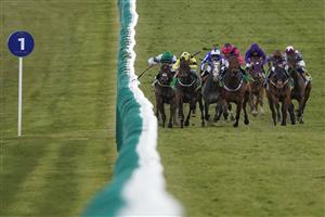 NEWMARKET, ENGLAND - APRIL 15: Daniel Tudhope riding Summerghand (R, brown cap) win The bet365 Abernant Stakes from Ryan Moore riding Oxted (pink) at Newmarket Racecourse on April 15, 2021 in Newmarket, England. Sporting venues around the UK remain under restrictions due to the Coronavirus Pandemic. Only owners are allowed to attend the meeting but the public must wait until further restrictions are lifted. (Photo by Alan Crowhurst/Getty Images)