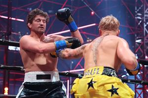 ATLANTA, GEORGIA - APRIL 17: Jake Paul punches Ben Askren in their cruiserweight bout during Triller Fight Club at Mercedes-Benz Stadium on April 17, 2021 in Atlanta, Georgia. (Getty Images)