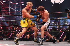 ATLANTA, GEORGIA - APRIL 17: Ben Askren punches Jake Paul in their cruiserweight bout during Triller Fight Club at Mercedes-Benz Stadium on April 17, 2021 in Atlanta, Georgia. (Getty Images)