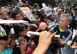 Real Madrid coach Jose Mourinho signs autographs for fans after a press conference at the UCLA campus on the eve of his teams friendly against the LA Galaxy, in Los Angeles on August 6, 2010. New Real Madrid coach Jose Mourinho has sent a potential warning to fans of the Spanish giants by claiming the teams he has coached do not reach their peak until his second season in charge. (Getty Images)