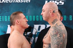 WOLLONGONG, AUSTRALIA - APRIL 20: Paul Gallen and Lucas Browne face off during the weigh in ahead of their bout at Novotel Wollongong Northbeach on April 20, 2021 in Wollongong, Australia. (Getty Images)