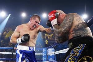WOLLONGONG, AUSTRALIA - APRIL 21: Paul Gallen punches Lucas Browne during their bout at WIN Entertainment Centre on April 21, 2021 in Wollongong, Australia. (Getty Images)