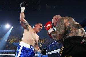 WOLLONGONG, AUSTRALIA - APRIL 21: Paul Gallen punches Lucas Browne during their bout at WIN Entertainment Centre on April 21, 2021 in Wollongong, Australia. (Getty Images)
