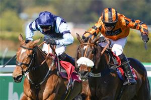 ESHER, ENGLAND - APRIL 24: David Bass riding Younevercall (orange) clear the last to win The bet365 Select Hurdle at Sandown Park Racecourse on April 24, 2021 in Esher, England. Sporting venues around the UK remain under restrictions due to the Coronavirus Pandemic. Only owners are allowed to attend the meeting but the public must wait until further restrictions are lifted. (Photo by Alan Crowhurst/Getty Images)