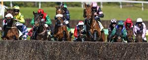 ESHER, ENGLAND - APRIL 24: A general view as runners clear the ditch during The bet365 Gold Cup Handicap Chase at Sandown Park Racecourse on April 24, 2021 in Esher, England. Sporting venues around the UK remain under restrictions due to the Coronavirus Pandemic. Only owners are allowed to attend the meeting but the public must wait until further restrictions are lifted. (Photo by Alan Crowhurst/Getty Images)