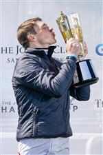 ESHER, ENGLAND - APRIL 24: Harry Skelton celebrates with his Champion Jockey trophy for the national hunt season 2020-21 at Sandown Park Racecourse on April 24, 2021 in Esher, England. Sporting venues around the UK remain under restrictions due to the Coronavirus Pandemic. Only owners are allowed to attend the meeting but the public must wait until further restrictions are lifted. (Photo by Alan Crowhurst/Getty Images)