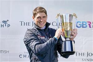 ESHER, ENGLAND - APRIL 24: Harry Skelton celebrates with his Champion Jockey trophy for the national hunt season 2020-21 at Sandown Park Racecourse on April 24, 2021 in Esher, England. Sporting venues around the UK remain under restrictions due to the Coronavirus Pandemic. Only owners are allowed to attend the meeting but the public must wait until further restrictions are lifted. (Photo by Alan Crowhurst/Getty Images)