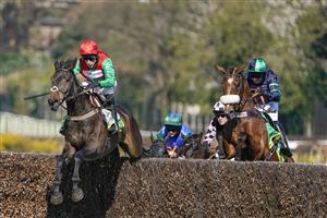 ESHER, ENGLAND - APRIL 24: Harry Skelton riding Enrilo (L, red cap) clear the last to win The bet365 Gold Cup Handicap Chase only to lose the race in the stewards room for interference at Sandown Park Racecourse on April 24, 2021 in Esher, England. Sporting venues around the UK remain under restrictions due to the Coronavirus Pandemic. Only owners are allowed to attend the meeting but the public must wait until further restrictions are lifted. (Photo by Alan Crowhurst/Getty Images)