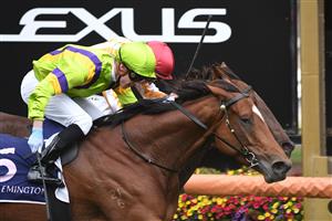 MELBOURNE, AUSTRALIA - APRIL 25: Daniel Moor riding Good and Proper winning Race 2, the Auckland Racing Club Trophy, during Anzac Day Race Day at Flemington Racecourse on April 25, 2021 in Melbourne, Australia. (Photo by Vince Caligiuri/Getty Images)