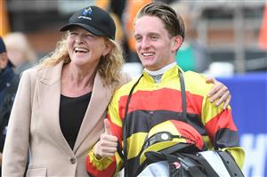 MELBOURNE, AUSTRALIA - APRIL 24: Monica Ryan poses with Michael Poy after he rode Still A Star to win Race 8, the Thoroughbred Club Anniversary Vase, during Melbourne Racing at Caulfield Racecourse on April 24, 2021 in Melbourne, Australia. (Photo by Vince Caligiuri/Getty Images)