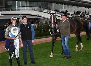 MELBOURNE, AUSTRALIA - APRIL 25: Billy Egan poses with trainer Luke Oliver after riding Real Sensation to win race 5, the Raaf Centenary, during Anzac Day Race Day at Flemington Racecourse on April 25, 2021 in Melbourne, Australia. (Photo by Vince Caligiuri/Getty Images)