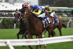 MELBOURNE, AUSTRALIA - APRIL 25: Teodore Nugent riding Our Lone Star winning Race 8, the Flt Lt Peter Armytage Handicap, during Anzac Day Race Day at Flemington Racecourse on April 25, 2021 in Melbourne, Australia. (Photo by Vince Caligiuri/Getty Images)