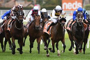 MELBOURNE, AUSTRALIA - APRIL 24: Ben Allen riding Blue Ocean winning Race 3, the Next Payments Handicap, during Melbourne Racing at Caulfield Racecourse on April 24, 2021 in Melbourne, Australia. (Photo by Vince Caligiuri/Getty Images)