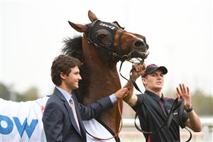 MELBOURNE, AUSTRALIA - APRIL 24: Trainer Sam Freedman poses with Open Minded after winning race 6, the Stow Storage Solutions Australia, during Melbourne Racing at Caulfield Racecourse on April 24, 2021 in Melbourne, Australia. (Photo by Vince Caligiuri/Getty Images)