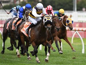 MELBOURNE, AUSTRALIA - APRIL 24: Ben Allen riding Blue Ocean winning Race 3, the Next Payments Handicap, during Melbourne Racing at Caulfield Racecourse on April 24, 2021 in Melbourne, Australia. (Photo by Vince Caligiuri/Getty Images)