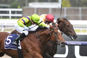 MELBOURNE, AUSTRALIA - APRIL 25: Daniel Moor riding Good and Proper winning Race 2, the Auckland Racing Club Trophy, during Anzac Day Race Day at Flemington Racecourse on April 25, 2021 in Melbourne, Australia. (Photo by Vince Caligiuri/Getty Images)