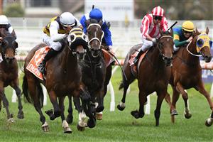 MELBOURNE, AUSTRALIA - APRIL 24: Ben Allen riding Blue Ocean winning Race 3, the Next Payments Handicap, during Melbourne Racing at Caulfield Racecourse on April 24, 2021 in Melbourne, Australia. (Photo by Vince Caligiuri/Getty Images)