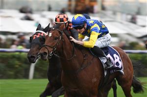 MELBOURNE, AUSTRALIA - APRIL 25: Teodore Nugent riding Our Lone Star winning Race 8, the Flt Lt Peter Armytage Handicap, during Anzac Day Race Day at Flemington Racecourse on April 25, 2021 in Melbourne, Australia. (Photo by Vince Caligiuri/Getty Images)