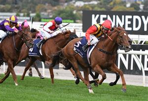 MELBOURNE, AUSTRALIA - APRIL 25: Damien Oliver riding Vassilator winning Race 7, the The Les Carlyon, during Anzac Day Race Day at Flemington Racecourse on April 25, 2021 in Melbourne, Australia. (Photo by Vince Caligiuri/Getty Images)