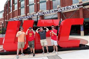 JACKSONVILLE, FL - APRIL 24: UCF 261 fans pose in front of the UFC logo at the entrance of VyStar Veterans Memorial Arena on April 24, 2021 in Jacksonville, Florida. (Getty Images)