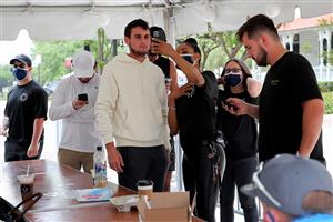 JACKSONVILLE, FL - APRIL 24: Clear App workers help ticket holders set up their phones at the entrance for fans attending the UFC 261 event at VyStar Veterans Memorial Arena on April 24, 2021 in Jacksonville, Florida. (Getty Images)