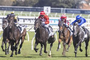 SYDNEY, AUSTRALIA - APRIL 24: Jamie Kah (red) on All Hallows's Eve wins race 2 the Mostyn Copper JHB Carr Stakes during Sydney Racing at Royal Randwick Racecourse on April 24, 2021 in Sydney, Australia. (/Getty)