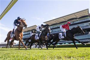 SYDNEY, AUSTRALIA - APRIL 24: Jamie Kah (red) on All Hallows's Eve wins race 2 the Mostyn Copper JHB Carr Stakes during Sydney Racing at Royal Randwick Racecourse on April 24, 2021 in Sydney, Australia. (/Getty)