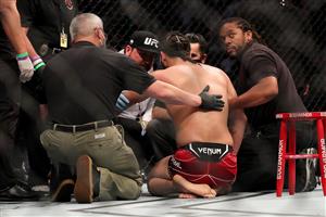 JACKSONVILLE, FL - APRIL 25: Jorge Masvidal of the United States talks to his trainers after getting knocked out by Kamaru Usman of Nigeria during the Welterweight Title bout of UFC 261 at VyStar Veterans Memorial Arena on April 25, 2021 in Jacksonville, Florida. (Getty Images)
