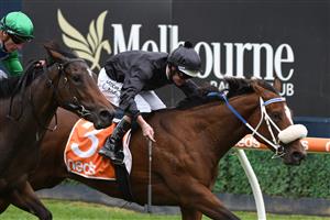 MELBOURNE, AUSTRALIA - APRIL 24: Luke Nolen riding Gimmie Par defeats Spinning in Race 1, the Wilde Racing Handicap, during Melbourne Racing at Caulfield Racecourse on April 24, 2021 in Melbourne, Australia. (Photo by Vince Caligiuri/Getty Images)