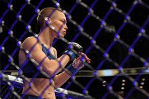JACKSONVILLE, FL - APRIL 24: Rose Namajunas of the United States fights Zhang Weili of China during the Women's Strawweight Title bout of UFC 261 at VyStar Veterans Memorial Arena on April 24, 2021 in Jacksonville, Florida. (Getty Images)