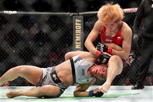 JACKSONVILLE, FL - APRIL 24: Liang Na of China brings down Ariane Carnelossi of Brazil during UFC 261 early prelims at VyStar Veterans Memorial Arena on April 24, 2021 in Jacksonville, Florida. (Getty Images)
